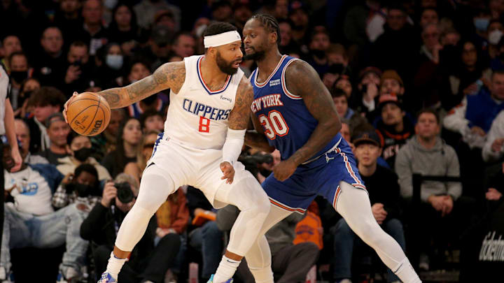 Jan 23, 2022; New York, New York, USA; Los Angeles Clippers forward Marcus Morris Sr. (8) controls the ball against New York Knicks forward Julius Randle (30) during the second quarter at Madison Square Garden. Mandatory Credit: Brad Penner-Imagn Images