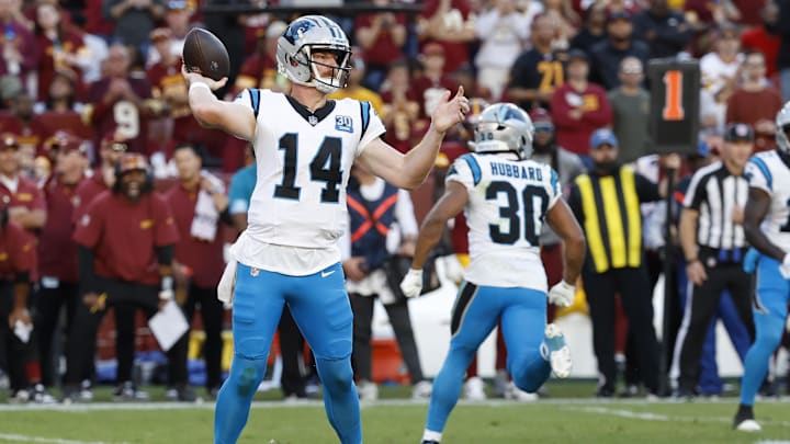 Oct 20, 2024; Landover, Maryland, USA; Carolina Panthers quarterback Andy Dalton (14) passes the ball against the Washington Commanders during the second quarter at Northwest Stadium. Mandatory Credit: Geoff Burke-Imagn Images