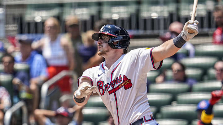 Atlanta Braves catcher Sean Murphy (12) hits a solo home run against the Baltimore Orioles during the ninth inning at Truist Park. 