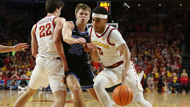 Iowa State Cyclones guard Tamin Lipsey (3) drives to the basket as BYU Cougars guard Dallin Hall (30) defends during the first half in the Senior Day Big-12 conference showdown of an NCAA college basketball at Hilton Coliseum on Wednesday, March 6, 2024, in Ames, Iowa.