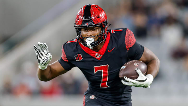 Oct 3, 2025; San Diego, California, USA; San Diego State Aztecs running back Lucky Sutton (7). Oct 3, 2025; San Diego, California, USA; San Diego State Aztecs running back Lucky Sutton (7).