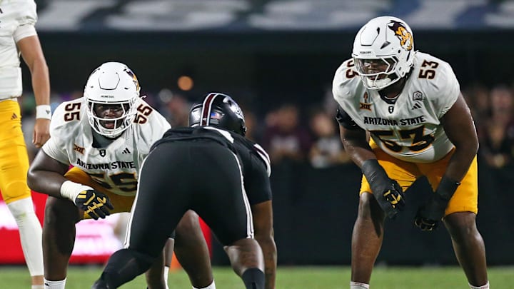 Sep 6, 2025; Starkville, Mississippi, USA; Arizona State Sun Devils offensive lineman Jimeto Obigbo (55) and offensive lineman Josh Atkins (53) wait for the snap during the second quarter against the Mississippi State Bulldogs at Davis Wade Stadium at Scott Field. Mandatory Credit: Petre Thomas-Imagn Images