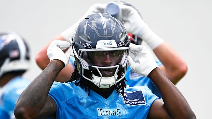 Tennessee Titans tight end Chig Okonkwo snaps his chin straps during an NFL football minicamp camp practice.