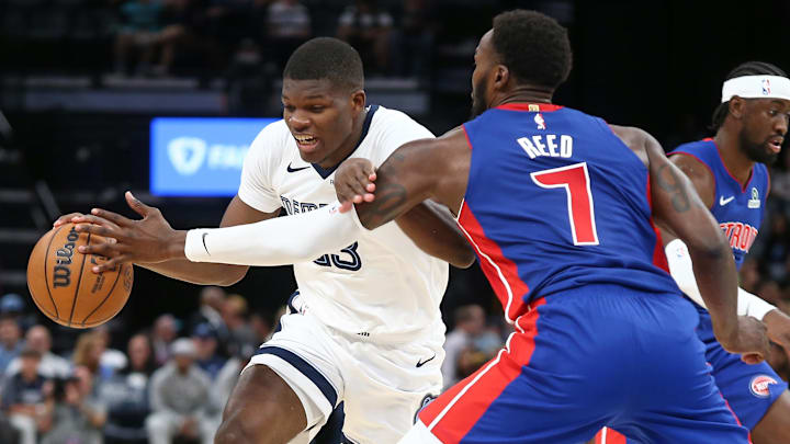 Oct 6, 2025; Memphis, Tennessee, USA; Memphis Grizzlies forward Cedric Coward (23) drives to the basket as Detroit Pistons forward Paul Reed (7) defends during the third quarter at FedExForum. Mandatory Credit: Petre Thomas-Imagn Images
