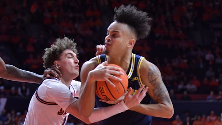 Feb 13, 2024; Champaign, Illinois, USA; Illinois Fighting Illini guard Niccolo Moretti (11) wrestles