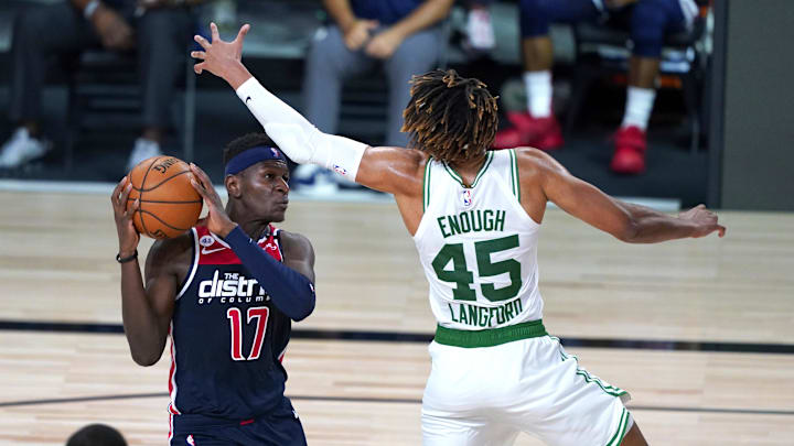 Aug 13, 2020; Lake Buena Vista, Florida, USA;  Washington Wizards' Isaac Bonga (17) looks to pass