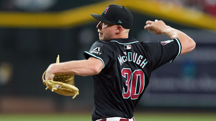 Jun 15, 2024; Phoenix, Arizona, USA; Arizona Diamondbacks pitcher Scott McGough (30) pitches against the Chicago White Sox during the first inning at Chase Field. Mandatory Credit: Joe Camporeale-Imagn Images Jun 15, 2024; Phoenix, Arizona, USA; Arizona Diamondbacks pitcher Scott McGough (30) pitches against the Chicago White Sox during the first inning at Chase Field. Mandatory Credit: Joe Camporeale-Imagn Images