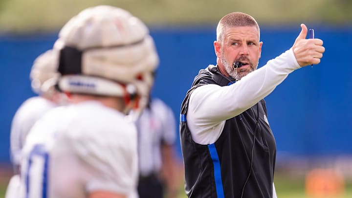 Florida Head Football Coach Billy Napier directs his players.