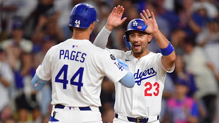 Aug 25, 2025; Los Angeles, California, USA; Los Angeles Dodgers center fielder Andy Pages (44) is greeted by left fielder Michael Conforto (23) after hitting a two run home run against the Cincinnati Reds during the fifth inning at Dodger Stadium. Mandatory Credit: Gary A. Vasquez-Imagn Images