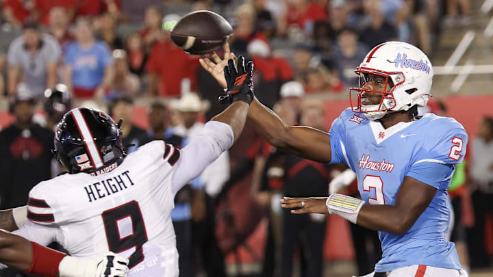Oct 4, 2025; Houston, Texas, USA; Houston Cougars quarterback Zeon Chriss (2) passes against Texas Tech Red Raiders defensive end Romello Height (9) in the second half at TDECU Stadium. Mandatory Credit: Thomas Shea-Imagn Images Oct 4, 2025; Houston, Texas, USA; Houston Cougars quarterback Zeon Chriss (2) passes against Texas Tech Red Raiders defensive end Romello Height (9) in the second half at TDECU Stadium. Mandatory Credit: Thomas Shea-Imagn Images