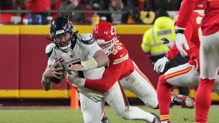 Jan 18, 2025; Kansas City, Missouri, USA; Houston Texans quarterback C.J. Stroud (7) is sacked by Kansas City Chiefs defensive end George Karlaftis (56) during the fourth quarter of a 2025 AFC divisional round game at GEHA Field at Arrowhead Stadium. Mandatory Credit: Denny Medley-Imagn Images