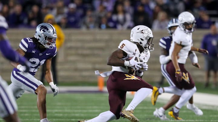 Nov 16, 2024; Manhattan, Kansas, USA; Arizona State Sun Devils wide receiver Melquan Stovall (5) is chased by Kansas State Wildcats safety Marques Sigle (21) during the third quarter at Bill Snyder Family Football Stadium. Mandatory Credit: Scott Sewell-Imagn Images