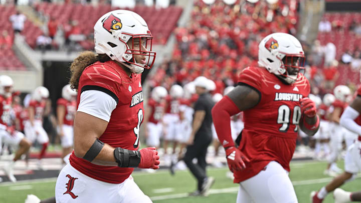 Aug 31, 2024; Louisville, Kentucky, USA; Louisville Cardinals defensive lineman Ashton Gillotte (9) warms up before facing off against the Austin Peay Governors at L&N Federal Credit Union Stadium. 