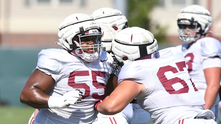 The Crimson Tide players and coaches continue working toward the season opener in practice Tuesday, Aug. 13, 2024. Alabama offensive lineman Roq Montgomery (55) blocks Alabama offensive lineman Wade Estess (67).