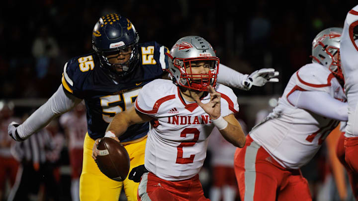 Streetsboro defensive lineman Arthur Scott III closes in on Northwest quarterback Chase Badger during a second-round playoff game Friday, Nov. 8, 2024.