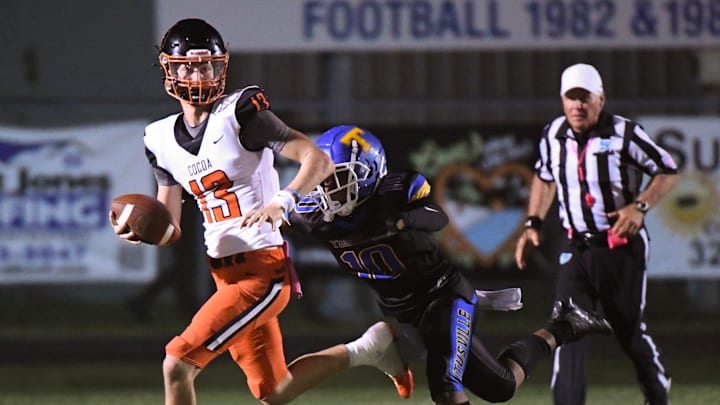 Brady Hart of Cocoa is pursued by Titusville’s Dwight Jenkins during their District 12-2S football game Friday, October 13, 2023.