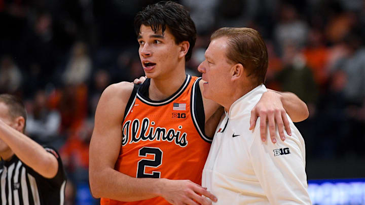 Dec 6, 2025; Nashville, Tennessee, USA; Illinois Fighting Illini guard Andrej Stojakovic (2) celebrates the win with head coach Brad Underwood against the Tennessee Volunteers during the second half at Bridgestone Arena. Mandatory Credit: Steve Roberts-Imagn Images Dec 6, 2025; Nashville, Tennessee, USA; Illinois Fighting Illini guard Andrej Stojakovic (2) celebrates the win with head coach Brad Underwood against the Tennessee Volunteers during the second half at Bridgestone Arena. Mandatory Credit: Steve Roberts-Imagn Images