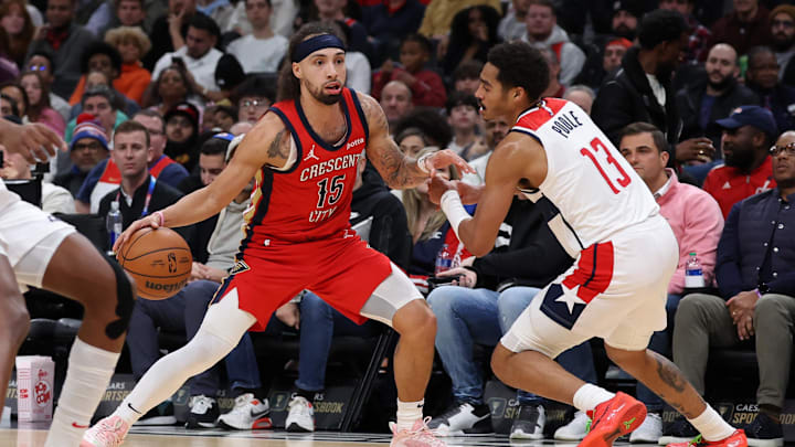 Dec 13, 2023; Washington, District of Columbia, USA; New Orleans Pelicans guard Jose Alvarado (15) dribbles the ball as Washington Wizards guard Jordan Poole (13) defends in the fourth quarter at Capital One Arena. Mandatory Credit: Geoff Burke-Imagn Images