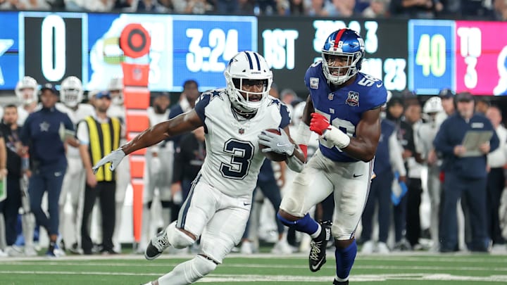 Dallas Cowboys wide receiver Brandin Cooks runs with the ball against New York Giants linebacker Bobby Okereke Dallas Cowboys wide receiver Brandin Cooks runs with the ball against New York Giants linebacker Bobby Okereke