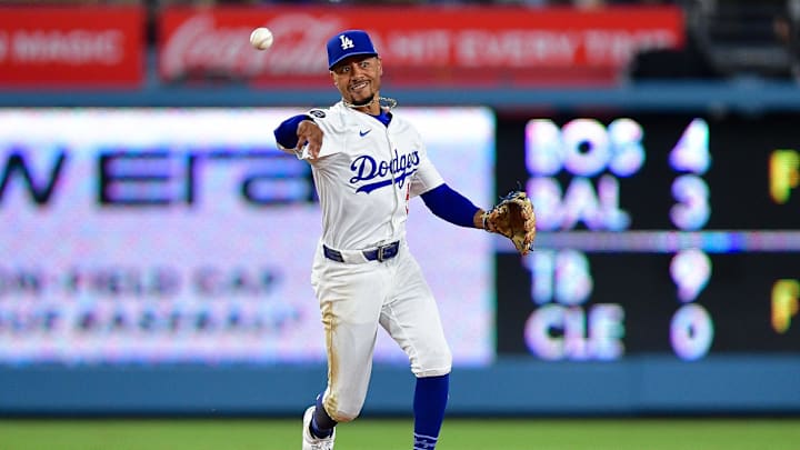 Aug 25, 2025; Los Angeles, California, USA; Los Angeles Dodgers shortstop Mookie Betts (50) throws to first for the out against Cincinnati Reds shortstop Elly De La Cruz (44) during the ninth inning at Dodger Stadium. Mandatory Credit: Gary A. Vasquez-Imagn Images Aug 25, 2025; Los Angeles, California, USA; Los Angeles Dodgers shortstop Mookie Betts (50) throws to first for the out against Cincinnati Reds shortstop Elly De La Cruz (44) during the ninth inning at Dodger Stadium. Mandatory Credit: Gary A. Vasquez-Imagn Images