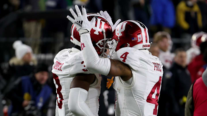 Dec 20, 2024; Notre Dame, Indiana, USA; Indiana Hoosiers wide receiver Omar Cooper Jr. (3) celebrates with wide receiver Myles Price (4) after a touchdown during the second half against the Notre Dame Fighting Irish at Notre Dame Stadium. Mandatory Credit: Trevor Ruszkowski-Imagn Images