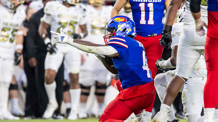 Nov 23, 2024; Kansas City, Missouri, USA;  Kansas running back Devin Neal (4) gestures for a first down during the 3rd quarter between the Kansas Jayhawks and the Colorado Buffaloes at GEHA Field at Arrowhead Stadium. Mandatory Credit: Nick Tre. Smith-Imagn Images