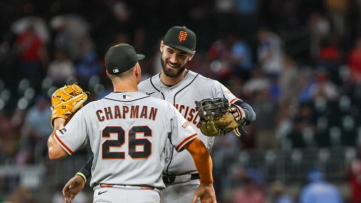 Cumberland, Georgia, USA; San Francisco Giants third baseman Matt Chapman (26) and designated hitter Bryce Eldridge (8) hug after a victory against the Atlanta Braves at Truist Park. Mandatory Credit: Jordan Godfree-Imagn Images