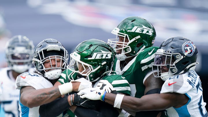 Tennessee Titans linebacker Ernest Jones IV (53) stops New York Jets running back Braelon Allen (0) on a run attempt during their game at Nissan Stadium in Nashville, Tenn., Sunday, Sept. 15, 2024.