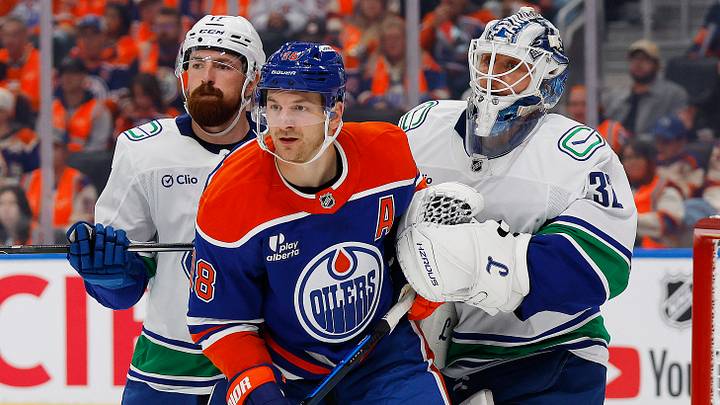 Sep 29, 2026; Edmonton, Alberta, CAN; Edmonton Oilers forward Zach Hyman (18) tries to screen Vancouver Canucks goaltender Kevin Lankinen (32) during the third period at Rogers Place. Mandatory Credit: Perry Nelson-Imagn Images Sep 29, 2026; Edmonton, Alberta, CAN; Edmonton Oilers forward Zach Hyman (18) tries to screen Vancouver Canucks goaltender Kevin Lankinen (32) during the third period at Rogers Place. Mandatory Credit: Perry Nelson-Imagn Images