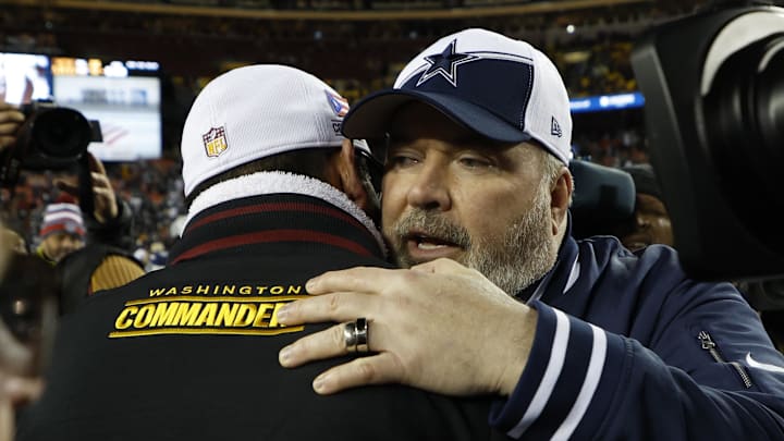 Jan 7, 2024; Landover, Maryland, USA; Washington Commanders head coach Ron Rivera (L) hugs Dallas Cowboys head coach Mike McCarthy (R) after their game at FedExField. Mandatory Credit: Geoff Burke-USA TODAY Sports