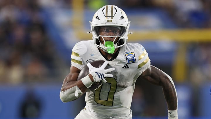 Dec 27, 2025; Orlando, FL, USA; Georgia Tech Yellow Jackets running back Malachi Hosley (0) runs the ball against the BYU Cougars in the third quarter during the Pop-Tarts Bowl at Camping World Stadium. Mandatory Credit: Nathan Ray Seebeck-Imagn Images