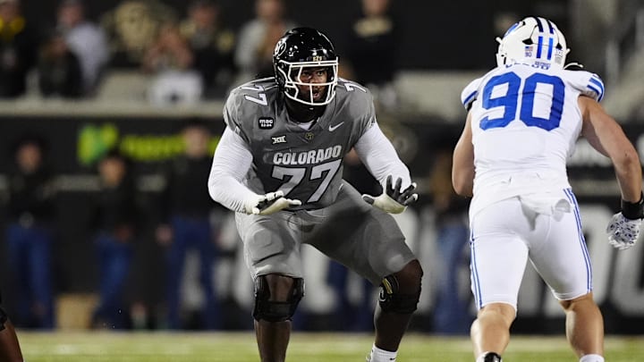 Sep 27, 2025; Boulder, Colorado, USA; Colorado Buffaloes offensive tackle Jordan Seaton (77) pass protects on Brigham Young Cougars defensive end Hunter Clegg (90) in the second quarter at Folsom Field. Mandatory Credit: Ron Chenoy-Imagn Images