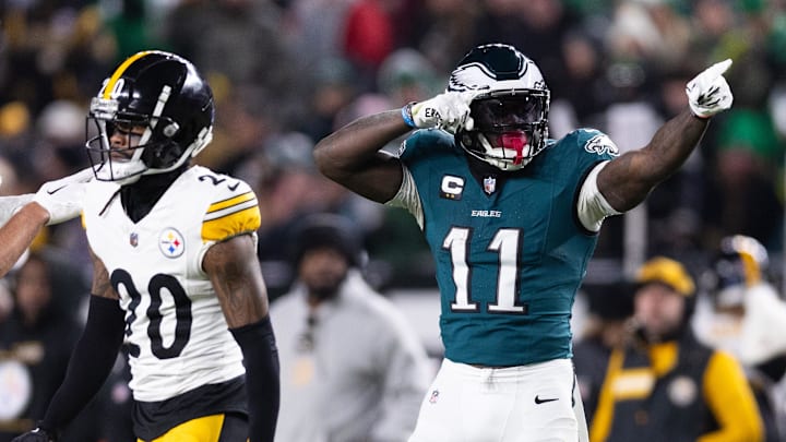 Dec 15, 2024; Philadelphia, Pennsylvania, USA; Philadelphia Eagles wide receiver A.J. Brown (11) reacts in front of Pittsburgh Steelers cornerback Cameron Sutton (20) after his first down catch during the second quarter at Lincoln Financial Field. Mandatory Credit: Bill Streicher-Imagn Images