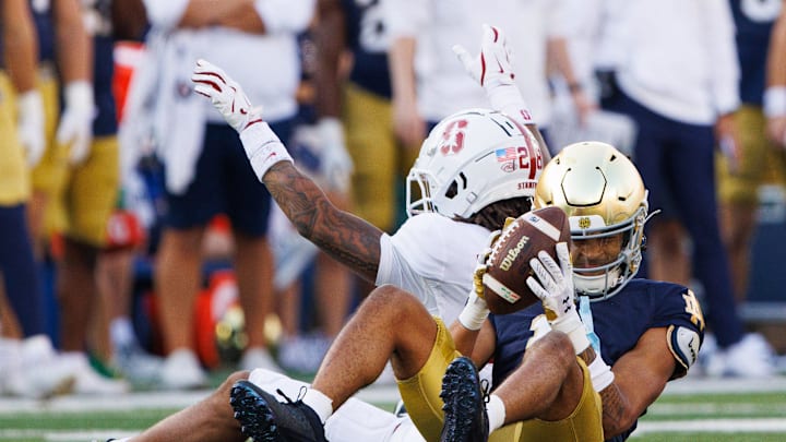 Notre Dame wide receiver KK Smith (11) makes a catch with Stanford cornerback Cam Richardson (28) defending during a NCAA college football game between Notre Dame and Stanford at Notre Dame Stadium on Saturday, Oct. 12, 2024, in South Bend.