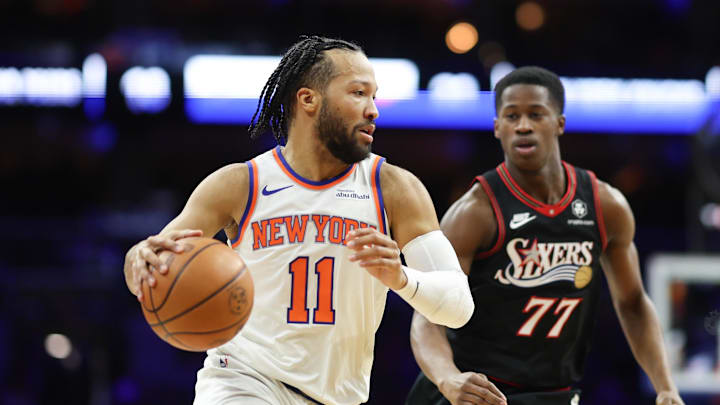 Jan 24, 2026; Philadelphia, Pennsylvania, USA; New York Knicks guard Jalen Brunson (11) dribbles the ball in front of Philadelphia 76ers guard Vj Edgecombe (77) during the first quarter at Xfinity Mobile Arena. Mandatory Credit: Bill Streicher-Imagn Images