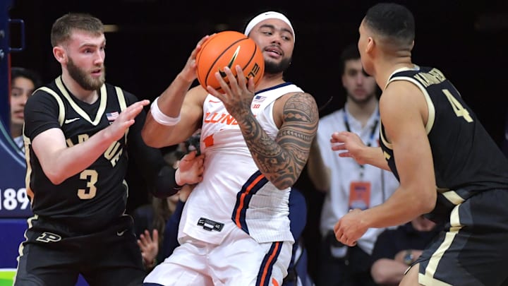 Mar 7, 2025; Champaign, Illinois, USA;  Purdue Boilermakers guard Braden Smith (3) and Trey Kaufman-Renn (4) pressure Illinois Fighting Illini guard Kylan Boswell (4) during the second half at State Farm Center. Mandatory Credit: Ron Johnson-Imagn Images