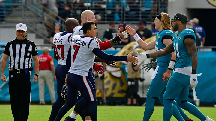 Team captains from the Houston Texans and Jacksonville Jaguars greet each other on the 50 yard line before the pregame coin toss. The Jacksonville Jaguars hosted the Houston Texans at TIAA Bank Field in Jacksonville, Florida Sunday, December 19, 2021. [Bob Self/Florida Times-Union