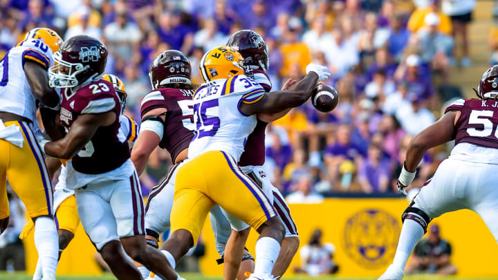 Sep 17, 2022; Baton Rouge, Louisiana, USA; LSU Tigers defensive end Sai'vion Jones (35) sacks Mississippi State Bulldogs quarterback Will Rogers (2) to cause a fumble at Tiger Stadium. Mandatory Credit: Scott Clause-USA TODAY Sports Sep 17, 2022; Baton Rouge, Louisiana, USA; LSU Tigers defensive end Sai'vion Jones (35) sacks Mississippi State Bulldogs quarterback Will Rogers (2) to cause a fumble at Tiger Stadium. Mandatory Credit: Scott Clause-USA TODAY Sports