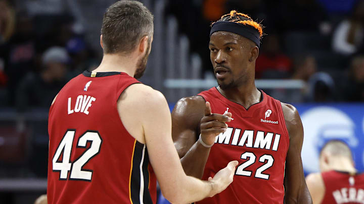 Dec 16, 2024; Detroit, Michigan, USA; Miami Heat forward Kevin Love (42) talks to forward Jimmy Butler (22) in the second half against the Detroit Pistons at Little Caesars Arena. Mandatory Credit: Rick Osentoski-Imagn Images