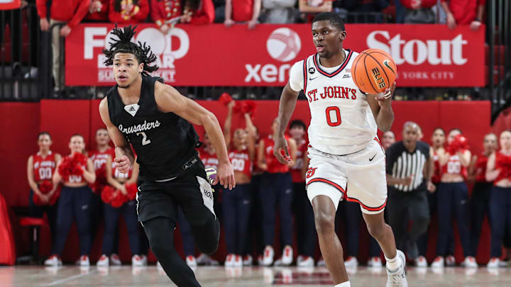 Nov 25, 2023; Queens, New York, USA;  St. John's Red Storm guard Cruz Davis (0) and Holy Cross