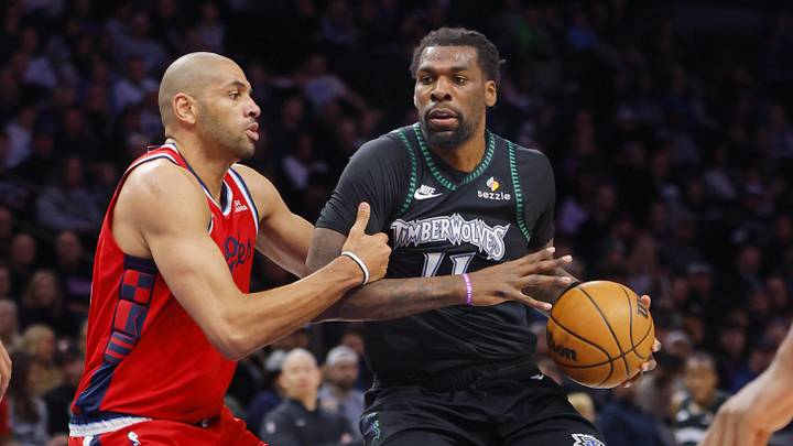 Minnesota Timberwolves center Naz Reid works around Los Angeles Clippers forward Nicolas Batum.
