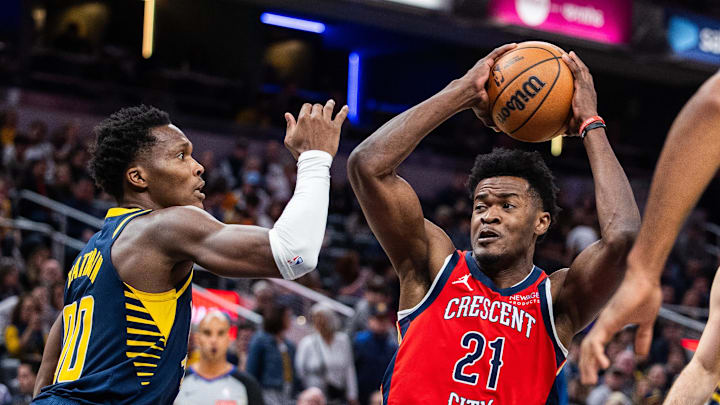 Nov 25, 2024; Indianapolis, Indiana, USA;  New Orleans Pelicans center Yves Missi (21) shoots the ball while Indiana Pacers guard Bennedict Mathurin (00) defends in the first half at Gainbridge Fieldhouse. Mandatory Credit: Trevor Ruszkowski-Imagn Images