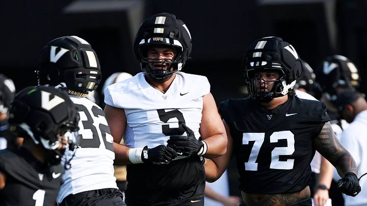 Vanderbilt defensive lineman Yilanan Ouattara (5) runs back to the huddle during fall practice Wednesday, July 30, 2025, in Nashville, Tenn. Vanderbilt defensive lineman Yilanan Ouattara (5) runs back to the huddle during fall practice Wednesday, July 30, 2025, in Nashville, Tenn.
