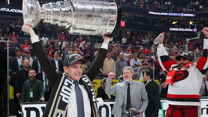 LAS VEGAS, NEVADA - JUNE 14: General manager Eric Tulsky lifts the Stanley Cup after Game Six of the 2026 Stanley Cup Final against the Vegas Golden Knights at T-Mobile Arena on June 14, 2026 in Las Vegas, Nevada. The Carolina Hurricanes won 3-0. (Photo by Bruce Bennett/Getty Images)