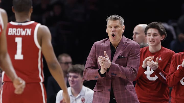 Oklahoma Sooners head coach Porter Moser celebrates after a play against the Oklahoma State Cowboys Oklahoma Sooners head coach Porter Moser celebrates after a play against the Oklahoma State Cowboys