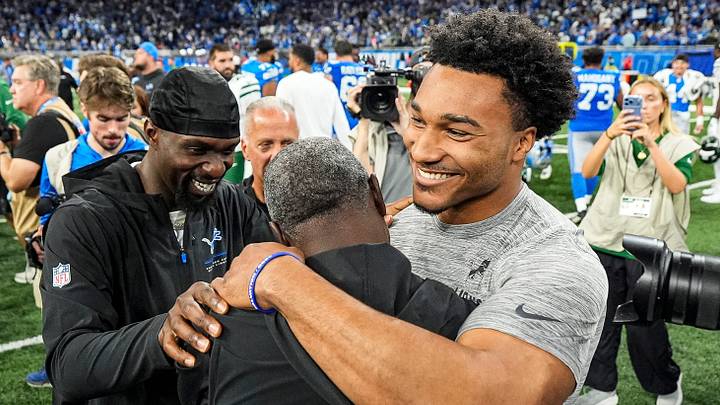 New York Jets head coach Aaron Glenn, center, hugs Detroit Lions safety Kerby Joseph (31), left, defensive back Brian Branch (32) after Detroit Lions 31-24 win over New York Jets at Ford Field in Detroit on Sunday, Sept. 27, 2026. New York Jets head coach Aaron Glenn, center, hugs Detroit Lions safety Kerby Joseph (31), left, defensive back Brian Branch (32) after Detroit Lions 31-24 win over New York Jets at Ford Field in Detroit on Sunday, Sept. 27, 2026.