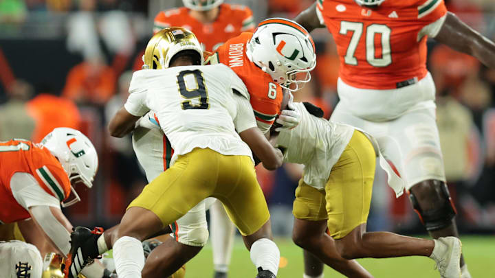 Aug 31, 2025; Miami Gardens, Florida, USA; Miami Hurricanes running back CharMar Brown (6) rushes the ball against the Notre Dame Fighting Irish at Hard Rock Stadium. Mandatory Credit: Sam Navarro-Imagn Images