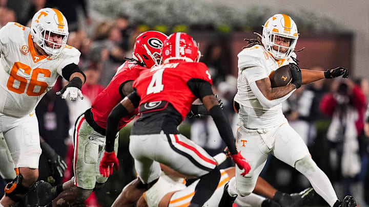 Tennessee running back Peyton Lewis (27) runs with the ball during a college football game between Tennessee and Georgia at Sanford Stadium in Athens, Ga., on Saturday, November 16, 2024.