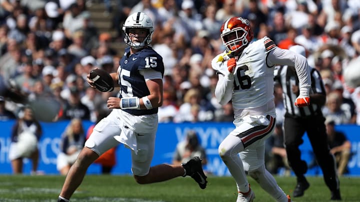 Penn State quarterback Drew Allar evades Bowling Green Falcons defensive linesman Chace Davis (16) during the third quarter at Beaver Stadium. Penn State quarterback Drew Allar evades Bowling Green Falcons defensive linesman Chace Davis (16) during the third quarter at Beaver Stadium.