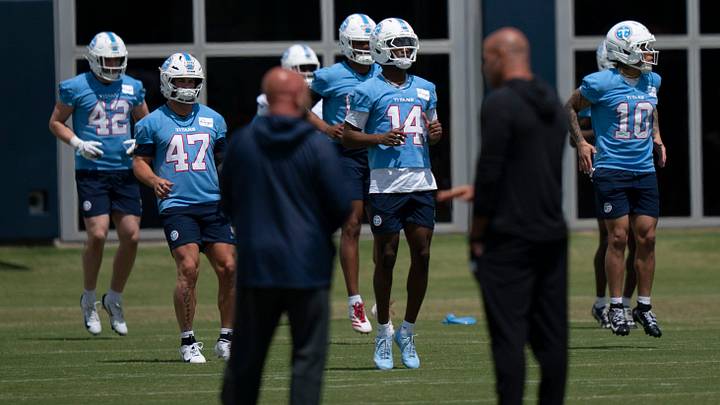 Tennessee Titans wide receiver Carnell Tate (14) who was drafter number four overall in the NFL Draft goes through warm ups during the Titans Rookie Camp Day 2 at Vanderbilt Health Football Center in Nashville, Tenn., Saturday, May 2, 2026. Tennessee Titans wide receiver Carnell Tate (14) who was drafter number four overall in the NFL Draft goes through warm ups during the Titans Rookie Camp Day 2 at Vanderbilt Health Football Center in Nashville, Tenn., Saturday, May 2, 2026.